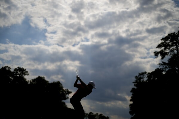 Rory McIlroy, of Northern Ireland, hits his tee shot on the 13th hole during the first round of the U.S. Open golf tournament Thursday, June 13, 2024, in Pinehurst, N.C. (AP Photo/Matt York)