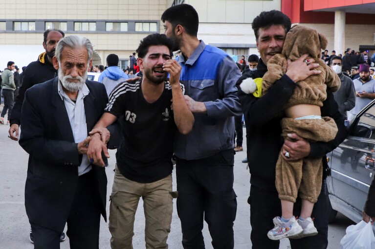 Families of victims of the explosions gather at the courtyard of a hospital in the city of Kerman, about 510 miles (820 kilometres) southeast of the capital Tehran, Iran, Wednesday, Jan. 3, 2024. Two bombs exploded Wednesday at a commemoration for a prominent Iranian general slain by the U.S. in a 2020 drone strike, Iranian officials said, as the Middle East remains on edge over Israel's war on Hamas in the Gaza Strip. (Sare Tajalli, ISNA via AP)