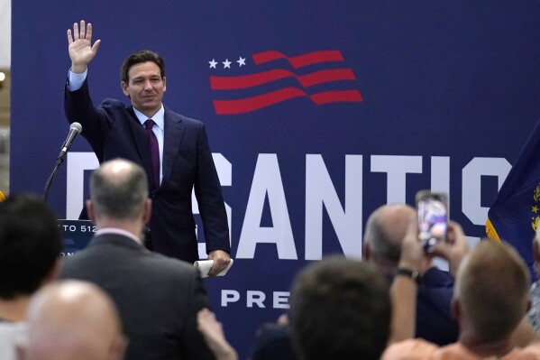 Republican presidential candidate Florida Gov. Ron DeSantis waves to guests during a campaign event, Monday, July 31, 2023, in Rochester, N.H. (AP Photo/Charles Krupa)