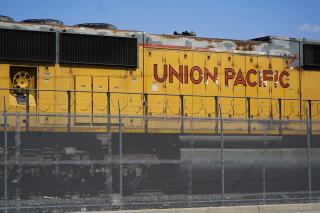 FILE - A Union Pacific train engine sits in a rail yard on Wednesday, Sept. 14, 2022, in Commerce, Calif. Union Pacific reports earnings on Thursday, April 20, 2023. (AP Photo/Ashley Landis, File)