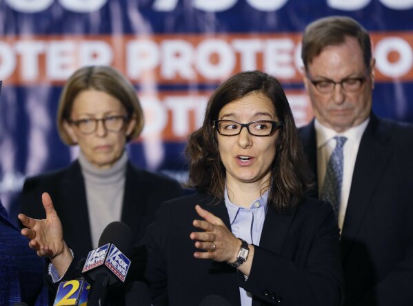 
              ​Lauren Groh-Wargo, Stacey Abrams' campaign manager, stands with attorneys as she speaks at a news conference Thursday, Nov. 8, 2018, in Atlanta. Republican Brian Kemp resigned Thursday as Georgia's secretary of state, a day after his campaign said he's captured enough votes to become governor despite his rival's refusal to concede. Abrams' campaign immediately responded by refusing to accept Kemp's declaration of victory in the race and demanding that state officials "count every single vote." (Bob Andres/Atlanta Journal-Constitution via AP)
            