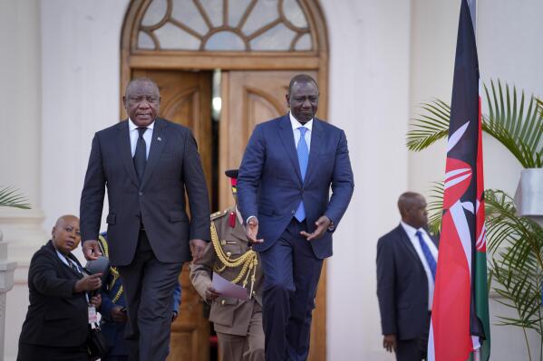 South Africa's President Cyril Ramaphosa, left, and Kenya's President William Ruto, right, arrive to speak to the media at State House in Nairobi, Kenya Wednesday, Nov. 9, 2022. The presidents of South Africa and Kenya said Wednesday they have resolved a long-standing visa dispute and Kenyans will be able to visit South Africa visa-free for up to 90 days in a calendar year. (AP Photo/Khalil Senosi)