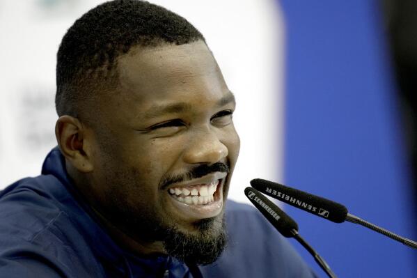 France's Marcus Thuram laughs during a press conference at the Jassim Bin Hamad stadium in Doha, Qatar, Thursday, Nov. 24, 2022. France will play in the World Cup against Denmark on Nov. 26. (AP Photo/Christophe Ena)