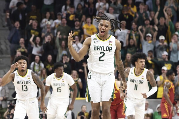 Baylor guard Jayden Nunn reacts after a 3-point basket oagainst Iowa State in the first half of an NCAA college basketball game, Saturday, Feb. 3, 2024, in Waco, Texas. (AP Photo/Rod Aydelotte)