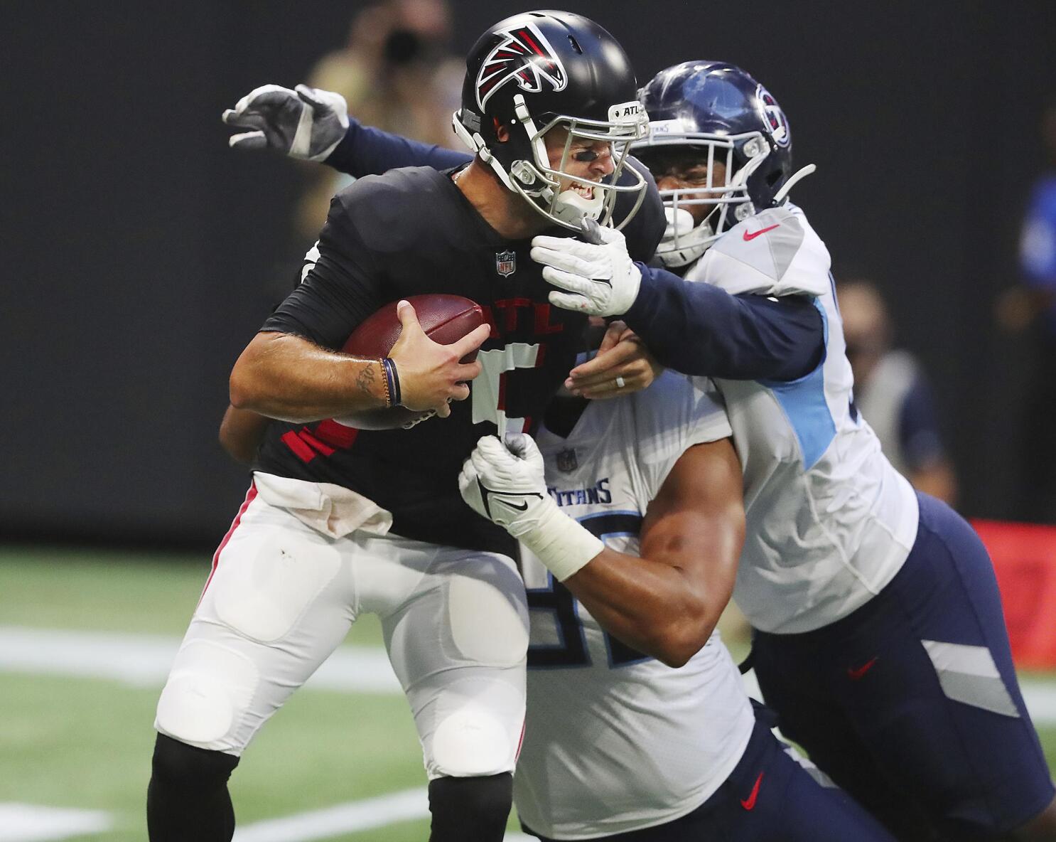 Woodside, Barkley throw TD passes, Titans beat Falcons 23-3