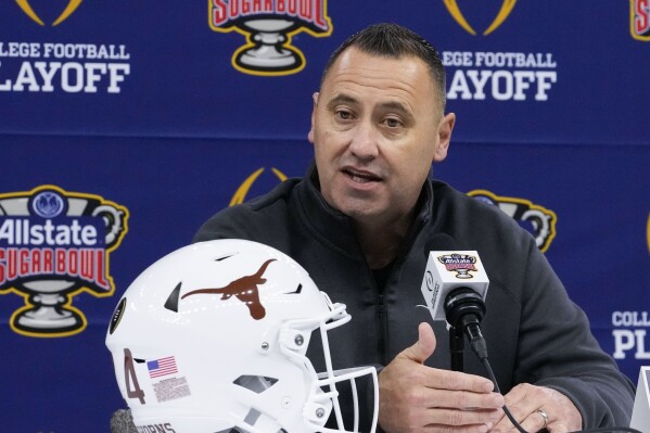 Texas head coach Steve Sarkisian speaks during media day for the the upcoming Sugar Bowl NCAA CFP college football semi-final game against Washington in New Orleans, Saturday, Dec. 30, 2023. (AP Photo/Gerald Herbert)