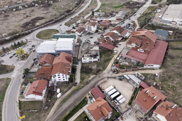An aerial photograph shows the site of a nightclub in the town of Kocani, North Macedonia, Sunday, March 16, 2025, following a massive fire in the nightclub early Sunday. (AP Photo/Armin Durgut)