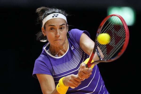 Caroline Garcia of Eagles, returns the ball to Paula Badosa of Falcons, during a match of the World Tennis League at Coca-Cola Arena, in Dubai, United Arab Emirates, Wednesday, Dec. 21, 2022. (AP Photo/Kamran Jebreili)