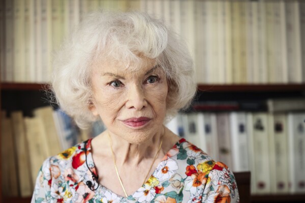 Marie-Pierre Pruvot, 89, known as Bambi, one of the first trans women in the world to become a public star, and a pioneer in global LGBTQ+ history, poses during an interview with the Associated Press, in Pantin, outside Paris, Tuesday, May 20, 2025. (AP Photo/Thomas Padilla)