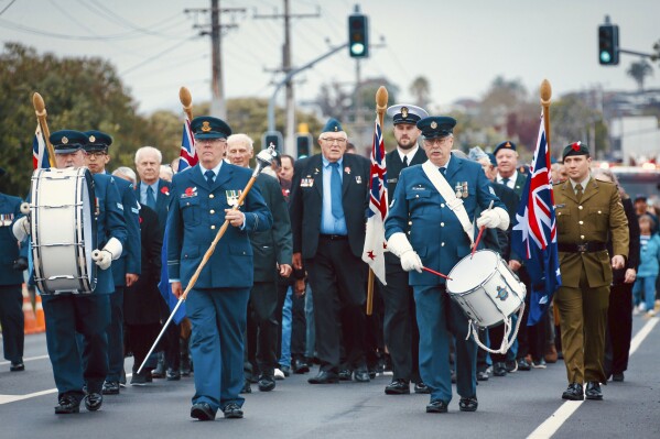 Veterans march during a Anzac Day parade at Hobsonville near Auckland, New Zealand, Thursday, April 25, 2024. (Dean Purcell/NZ Herald via AP)