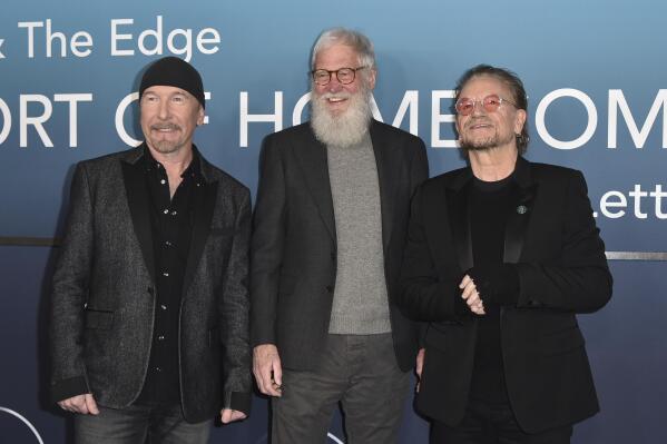 The Edge, from left, David Letterman and Bono arrive at the premiere of "Bono & The Edge: A Sort of Homecoming, With Dave Letterman" on Wednesday, March 8, 2023, at The Orpheum Theatre in Los Angeles. (Photo by Richard Shotwell/Invision/AP)