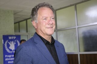 FILE - World Food Program (WFP) Executive Director David Beasley speaks to the media about the organization's Nobel Peace Prize win, at the airport in Ouagadougou, Burkina Faso, late Friday, Oct. 9, 2020. Beasley says the Nobel Peace Prize has given the U.N. agency a spotlight and megaphone to warn world leaders that next year is going to be worse than this year, and without billions of dollars “we are going to have famines of biblical proportions in 2021.” (AP Photo/Sam Mednick)