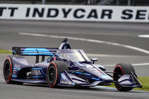 FILE - Jimmie Johnson drives through a turn during the IndyCar auto race at Indianapolis Motor Speedway in Indianapolis, May 15, 2021. The IndyCar season begins this weekend in St. Petersburg, Fla. (AP Photo/Michael Conroy, File)