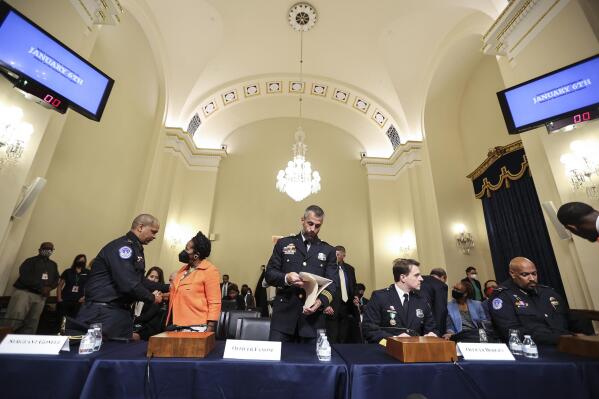 U.S. Capitol Police Sgt. Aquilino Gonell, left, shakes hands with Rep. Sheila Jackson-Lee, D-Texas, after a House select committee hearing on the Jan. 6 attack on Capitol Hill in Washington, Tuesday, July 27, 2021. From left, Gonell, Jackson-Lee, Washington Metropolitan Police Department officer Michael Fanone, Washington Metropolitan Police Department officer Daniel Hodges and U.S. Capitol Police Sgt. Harry Dunn. (Oliver Contreras/The New York Times via AP, Pool)