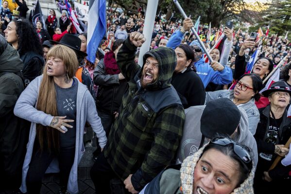 Protesters perform a haka outside parliament in Wellington, New Zealand, Tuesday, May 20, 2025. (David Unwin/Stuff via AP)