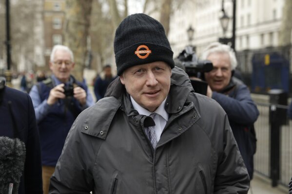 FILE - In this Tuesday, March 19, 2019 file photo, Boris Johnson, Britain's former Foreign Secretary and prominent leave the European Union Brexit campaigner walks away after leaving the Cabinet Office in London. Britain’s High Court has quashed a bid to prosecute Conservative lawmaker Boris Johnson for allegedly lying during the country’s 2016 European Union membership referendum. Two judges on Friday, June 7 threw out a lower court’s ruling that Johnson should be summoned to answer questions about Brexit campaigners’ claim that Britain pays 350 million pounds ($446 million) a week to the EU. (AP Photo/Matt Dunham, File)