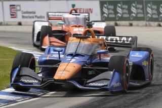 Felix Rosenqvist races during the first race of the IndyCar Detroit Grand Prix auto racing doubleheader on Belle Isle in Detroit Saturday, June 12, 2021. (AP Photo/Paul Sancya)