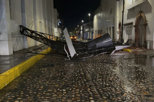 A communications antenna lays on the street after Hurricane Lidia hit, in Puerto Vallarta, Mexico, Wednesday, Oct. 11, 2023. Lidia dissipated Wednesday after hitting land as a Category 4 hurricane. (AP Photo/Valentin Gonzalez)