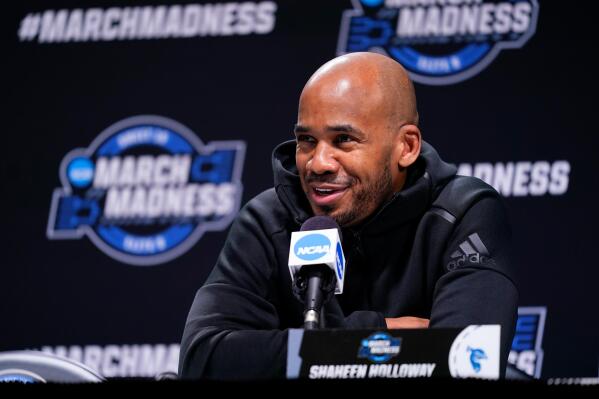 Saint Peter's head coach Shaheen Holloway speaks with members of the media during a news conference for the NCAA men's college basketball tournament, Saturday, March 26, 2022, in Philadelphia. (AP Photo/Matt Rourke)