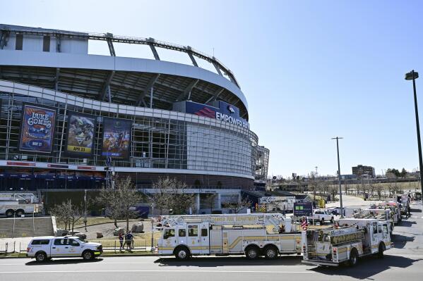 Denver Broncos stadium Empower Field at Mile High on fire as dark clouds of  smoke billow from building