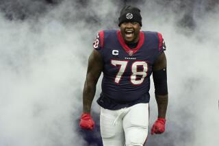 Tunsil looks to lead Texans after signing 3-year extension