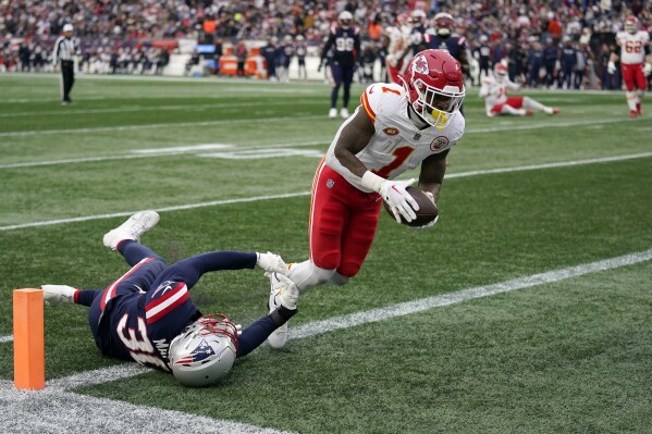 Kansas City Chiefs running back Jerick McKinnon (1) scores a touchdown against New England  on Dec. 17, 2023, in Foxborough, Mass. (AP Photo/Charles Krupa)