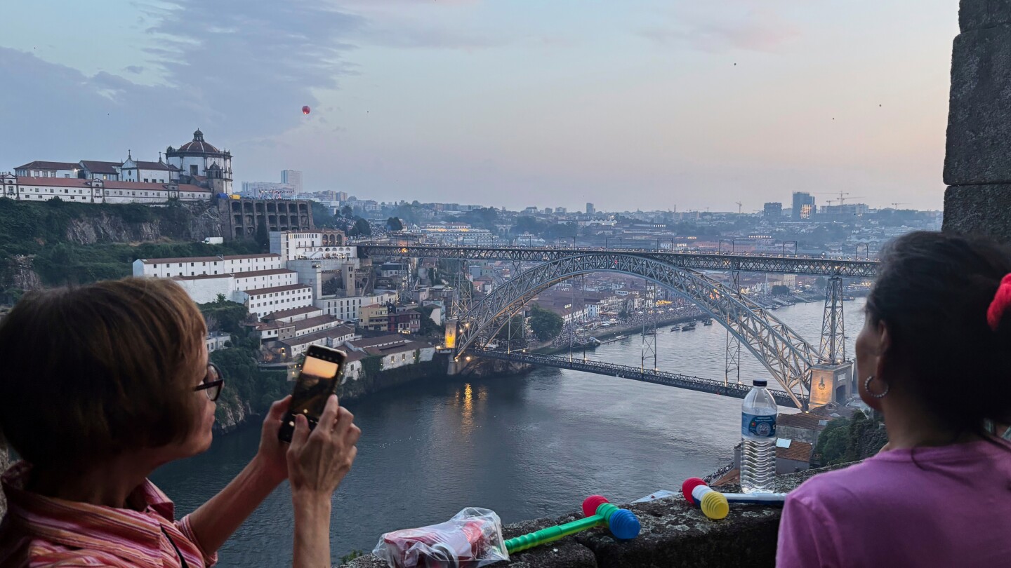 Porto celebrates the summer and a beloved saint with plastic hammers, sardines and leeks