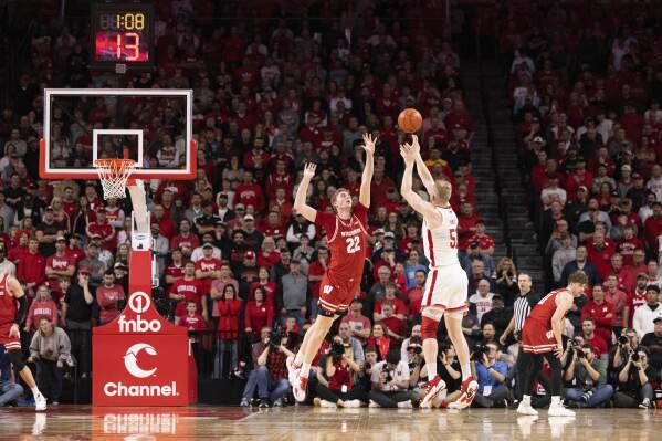 Nebraska's Rienk Mast (51) shoots a three pointer against Wisconsin's Steven Crowl (22) during the second half of an NCAA college basketball game Thursday, Feb. 1, 2024, in Lincoln, Neb. Nebraska defeated Wisconsin 80-72 in overtime. (AP Photo/Rebecca S. Gratz)