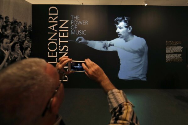 
              In this Wednesday, March 14, 2018 photo, a journalist takes a photo during a press preview of the Leonard Bernstein exhibit at the National Museum of American Jewish History in Philadelphia. The exhibit on the acclaimed composer and conductor opens March 16 and runs through Sept. 2, 2018. (AP Photo/Matt Slocum)
            