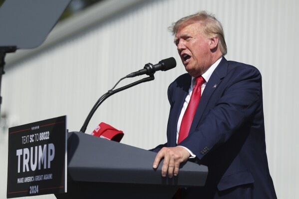 FILE - Former President Donald Trump speaks at a rally in Summerville, S.C., Monday, Sept. 25, 2023. Trump plans to use a college football rivalry weekend to bask among his supporters in South Carolina, while potentially upstaging his Republican opponent Nikki Haley on her home turf. The front-runner for the 2024 Republican nomination will be on hand Saturday as the University of South Carolina Gamecocks host the Tigers of Clemson University in the annual Palmetto Bowl. (AP Photo/Artie Walker Jr., File)