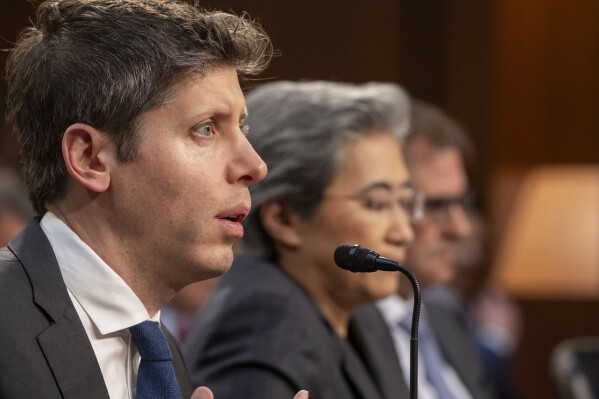 Sam Altman, Co-Founder and Chief Executive Officer, OpenAI, from left, testifies before a Senate Committee on Commerce, Science, and Transportation hearing with Dr. Lisa Su, Chief Executive Officer and Chair, Advanced Micro Devices (AMD), and Michael Intrator, Co-Founder and Chief Executive Officer, CoreWeave, Thursday, May 8, 2025, in Washington. (AP Photo/Kevin Wolf)