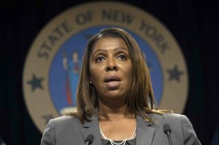 FILE - In this June 11, 2019, file photo, New York Attorney General Letitia James speaks during a news conference, in New York.  New York state, New York City, Connecticut and Vermont have filed a new legal challenge to new Trump administration rules blocking green cards for many immigrants who use public assistance including Medicaid, food stamps and housing vouchers.  James, a Democrat, says the change is a “clear violation” of American values and 100 years of case law.  (AP Photo/Mary Altaffer, File)