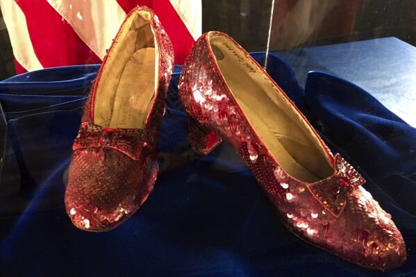 FILE - Ruby slippers once worn by Judy Garland in the "The Wizard of Oz" are displayed at a news conference on Sept. 4, 2018, at the FBI office in Brooklyn Center, Minn. Terry Jon Martin, the aging reformed mobster who has admitted stealing the slippers, gave into the temptation of “one last score” after an old mob associate led him to believe the famous shoes must be adorned with real jewels to justify their $1 million insured value according to a new memo filed ahead of his Monday, Jan. 29, 2024, sentencing in Duluth, Minn. (AP Photo/Jeff Baenen, File)