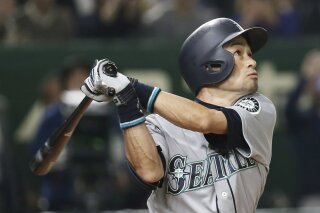 
              FILE - In this March 20, 2019, file photo, Seattle Mariners' Ichiro Suzuki pops out in the third inning of Game 1 of the Major League Baseball opening series against the Oakland Athletics at Tokyo Dome in Tokyo.  Suzuki has rejoined the Mariners as a special assistant to the chairman and will work as an instructor with both the major league club and some of the organization’s players in the minors. (AP Photo/Koji Sasahara, File)
            