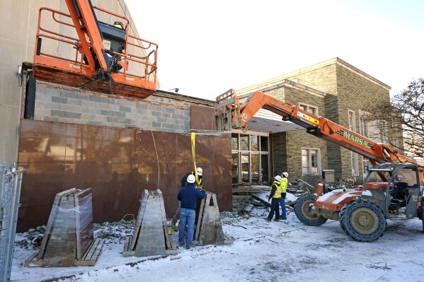 FILE - Workers begin demolition Wednesday, Jan. 17, 2023, at the Tree of Life building in Pittsburgh, the site of the deadliest antisemitic attack in U.S. history, as part of the effort to reimagine the building to honor the 11 people who were killed there in 2018. (AP Photo/Gene J. Puskar, File)
