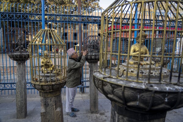 Iron cages are erected around statues as a precaution against theft at Rato Machindranath temple in Lalitpur, Nepal, Thursday, Feb. 8, 2024. An unknown number of sacred statues of Hindu deities were stolen and smuggled abroad in the past. Now dozens are being repatriated to the Himalayan nation, part of a growing global effort to return such items to countries in Asia, Africa and elsewhere. (AP Photo/Niranjan Shrestha)