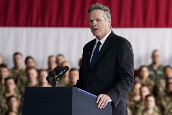 FILE - Alaska Gov. Mike Dunleavy speaks at Joint Base Elmendorf-Richardson to mark the anniversary of the Sept. 11 terrorist attacks, Sept. 11, 2023, in Anchorage, Alaska. Dunleavy’s State of the State speech was been postponed until Tuesday, Jan. 30, 2024, after high winds in the capital city disrupted flights. (AP Photo/Evan Vucci, File)