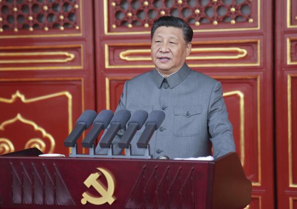 In this photo provided by China's Xinhua News Agency, Chinese President and party leader Xi Jinping delivers a speech at a ceremony marking the centenary of the ruling Communist Party in Beijing, China, Thursday, July 1, 2021. China’s Communist Party is marking the 100th anniversary of its founding with speeches and grand displays intended to showcase economic progress and social stability to justify its iron grip on political power that it shows no intention of relaxing. (Li Xueren/Xinhua via AP)
