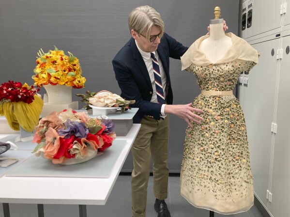 Curator Andrew Bolton displays garments in the conservation space of the Costume Institute of the Metropolitan Museum of Art in Manhattan, Nov. 8, 2023. The garments will be part of the upcoming spring exhibit at the Costume Institute, launched by the Met Gala. “Sleeping Beauties: Reawakening Fashion” will run from May 10-Sept. 2, 2024. (AP Photo/Jocelyn Noveck)