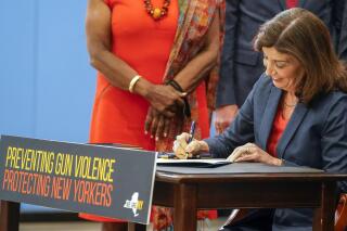 FILE — New York Gov. Kathy Hochul signs a package of bills to strengthen gun laws, June 6, 2022, in New York. The Supreme Court, Thursday, June 23, 2022, struck down a restrictive New York gun law in a major ruling for gun rights. (AP Photo/Mary Altaffer, File)