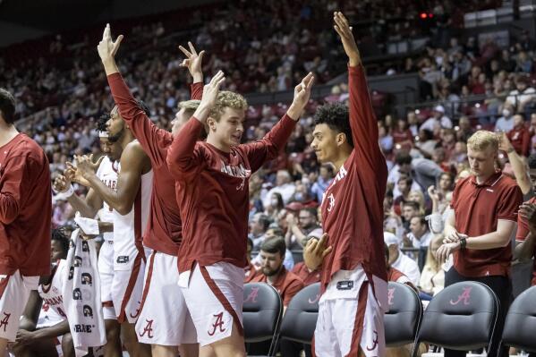 Alabama's bench celebrates a 3-point shot during the second half of the team's NCAA college basketball game against Mississippi State, Wednesday, Feb. 16, 2022, in Tuscaloosa, Ala. (AP Photo/Vasha Hunt)