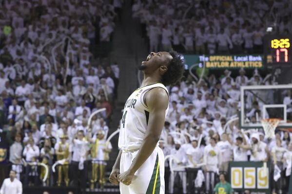 Baylor guard LJ Cryer (4) reacts after a teammate scored against Kansas during the second half of an NCAA college basketball game Monday, Jan. 23, 2023, in Waco, Texas. (AP Photo/Jerry Larson)