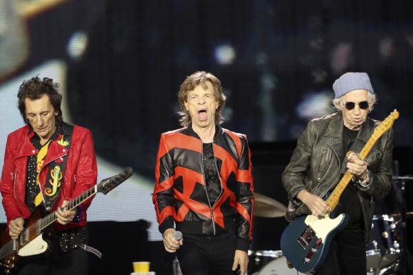 FILE - Ronnie Wood, left, Mick Jagger, center, and Keith Richards, of the Rolling Stones play on stage at the Anfield stadium in Liverpool, England, during a concert as part of their "Sixty" European tour, Thursday, June 9, 2022. The Rolling Stones canceled their concert in Amsterdam Monday just hours before it was due to start after lead singer Mick Jagger tested positive for COVID-19.
The band announced the cancelation in a statement, saying the 78-year-old Jagger tested positive “after experiencing symptoms of COVID upon arrival at the stadium” on the outskirts of Amsterdam. (AP Photo/Scott Heppell, File)
