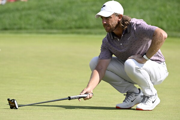 Tommy Fleetwood, of England, lines up his put on the ninth green during the third round of the Travelers Championship golf tournament at TPC River Highlands, Saturday, June 21, 2025, in Cromwell, Conn. (AP Photo/Jessica Hill)