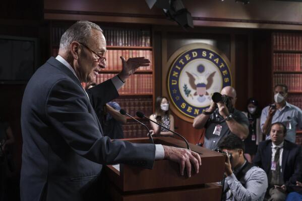 Senate Majority Leader Chuck Schumer, D-N.Y., talks to reporters about the agreement reached with Sen. Joe Manchin, D-W.Va., that they had sought for months on health care, energy and climate issues, taxes on higher earners and corporations, at the Capitol in Washington, Thursday, July 28, 2022. (AP Photo/J. Scott Applewhite)