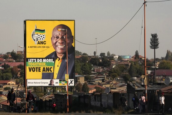 FILE - An election poster, with President Cyril Ramaphosa atop a pole in Soweto, South Africa, on April 22, 2024. Ramaphosa has tried to rebuild the reputation of the ANC by cracking down on government graft, but unemployment has risen to 32% under him and he has struggled to curb poverty. (AP Photo/Themba Hadebe, File)