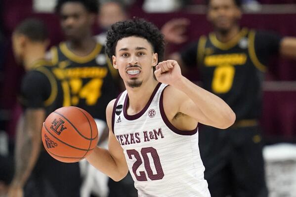 FILE - Texas A&M guard Andre Gordon (20) brings the ball down court against Missouri during the first half of an NCAA college basketball game in College Station, texas, in this Saturday, Jan. 16, 2021, file photo. Texas A&M’s top returning players are Andre Gordon, Hassan Diarra and Hayden Hefner. Gordon started every game last season and averaged 8.3 points, 2.4 rebound and 2.7 assists, but the other two players were used mostly as reserves.   (AP Photo/Sam Craft, File)