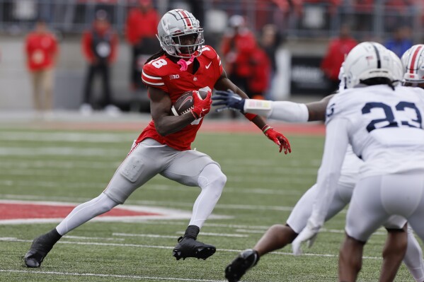 Ohio State receiver Marvin Harrison runs after a catch against Penn State during the first half of an NCAA college football game Saturday, Oct. 21, 2023, in Columbus, Ohio. (AP Photo/Jay LaPrete)