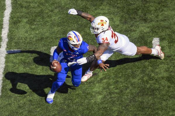 Iowa State linebacker O'Rien Vance (34) pressures Kansas quarterback Jalon Daniels (6) during the first half of an NCAA college football game, Saturday, Oct. 1, 2022, in Lawrence, Kan. (AP Photo/Reed Hoffmann)