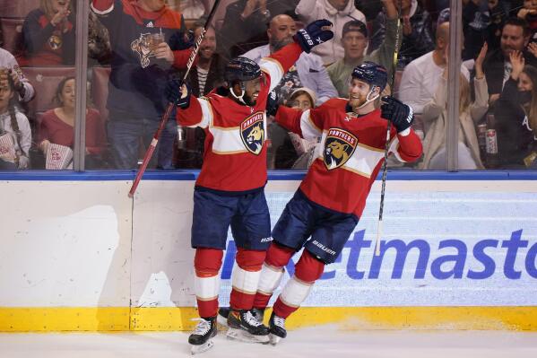 Florida Panthers left wing Anthony Duclair, left, helps center Sam Bennett celebrate his goal during the second period of an NHL hockey game against the Dallas Stars, Friday, Jan. 14, 2022, in Sunrise, Fla. (AP Photo/Wilfredo Lee)